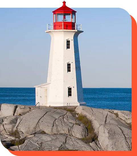 A lighthouse standing firm on a rocky shore
